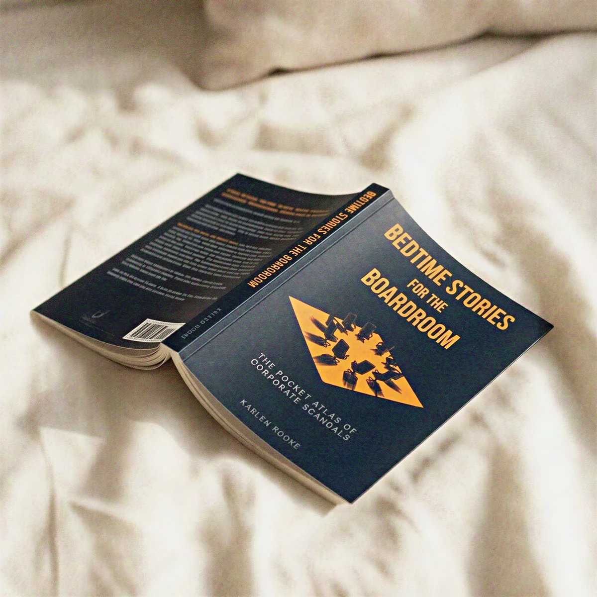 The book resting open on a pillow — bedtime stories, literally